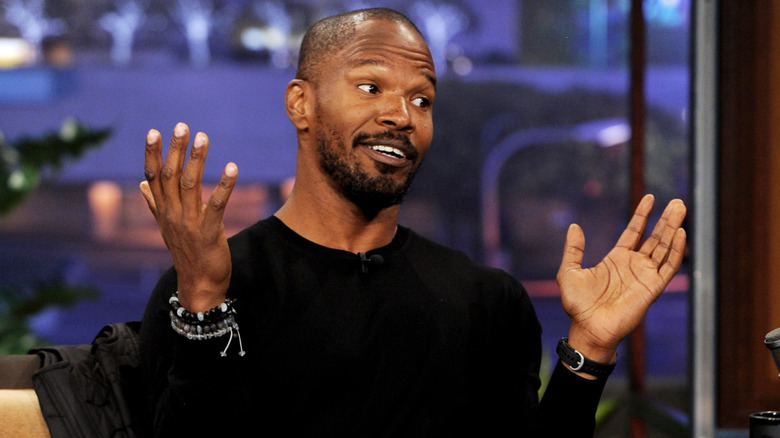Jamie Foxx with hands up