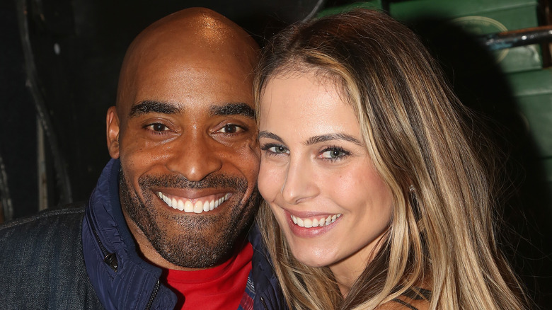 Tiki Barber posing with Traci Lynn Johnson