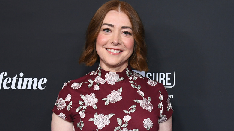 Alyson Hannigan wearing a red floral dress