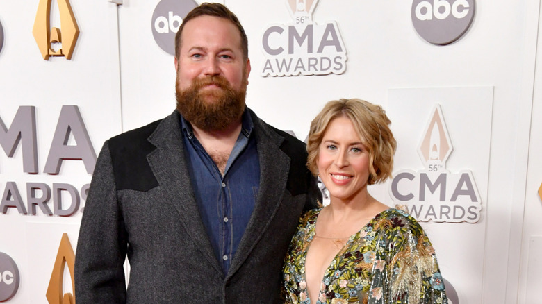 Erin and Ben Napier smile on a 2022 red carpet