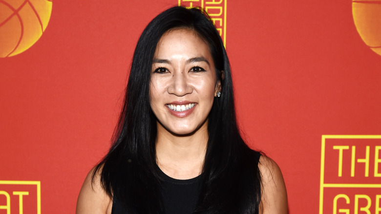 Michelle Kwan smiling in a black outfit