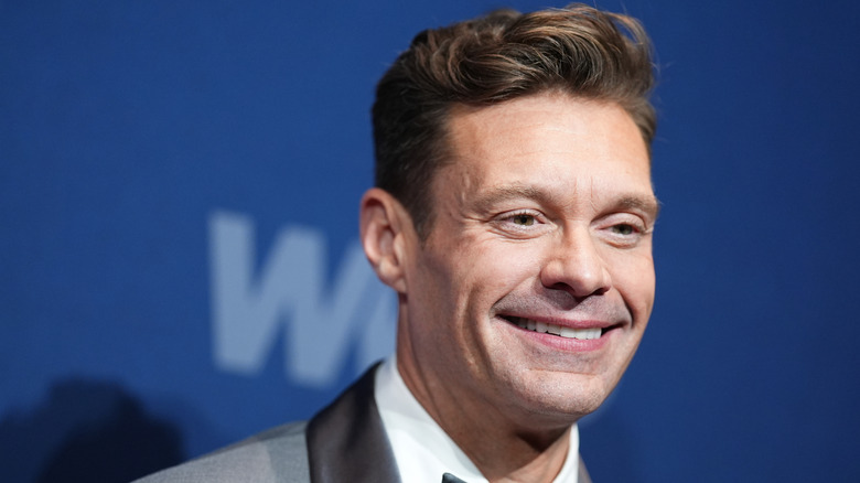 Ryan Seacrest smiling for a photo.