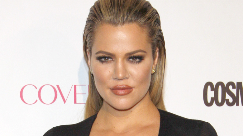 Khloe Kardashian smirking