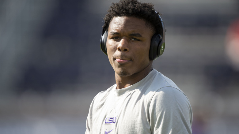 Kyren Lacy on the field with headphones in 2023