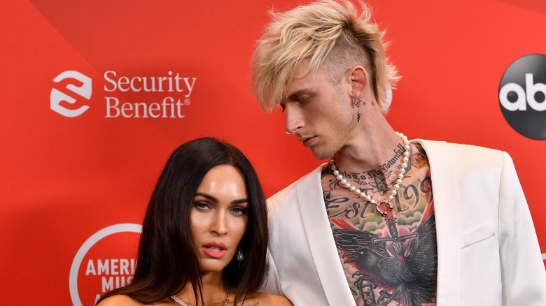 Machine Gun Kelly looking at Megan Fox