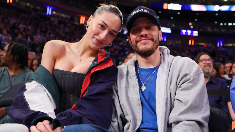 Pete Davidson and Elsie Hewitt posing courtside