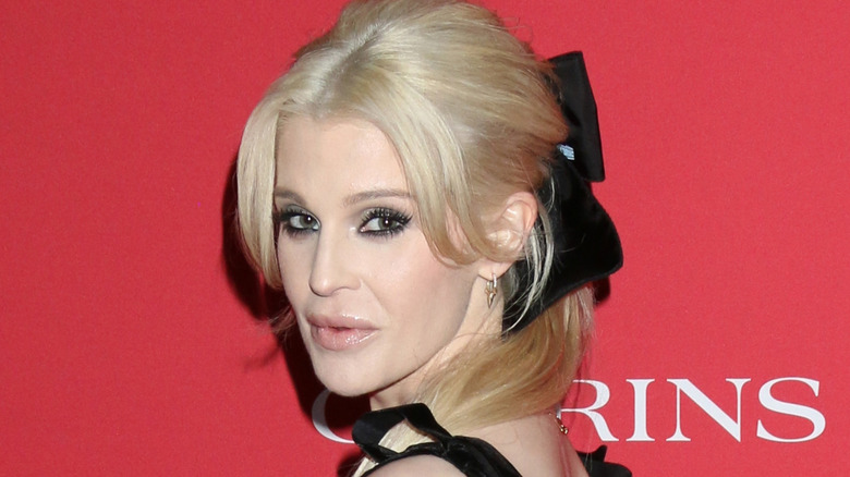 Kelly Osbourne poses for a photo
