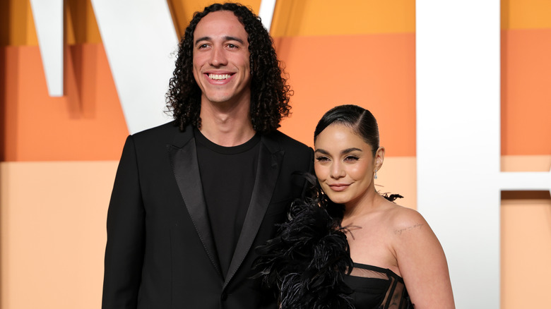 Cole Tucker and Vanessa Hudgens posing